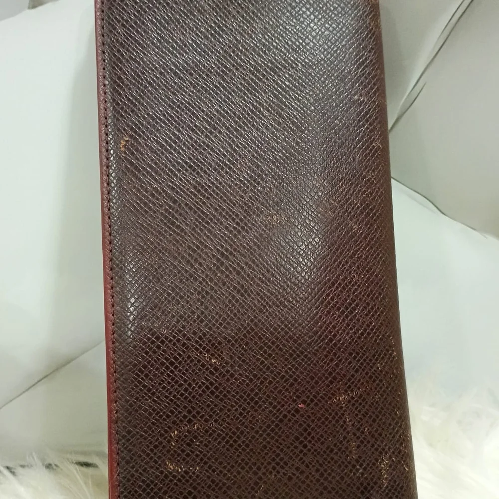 Louis Vuitton Taiga leather long wallet.